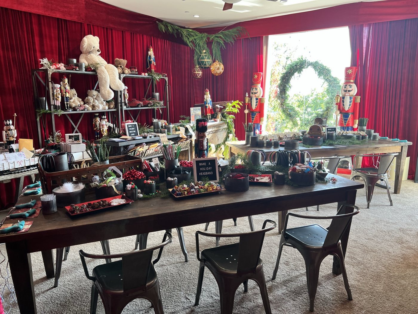 Holiday-themed making stations with nutcrackers and craft materials at Netflix Holiday House